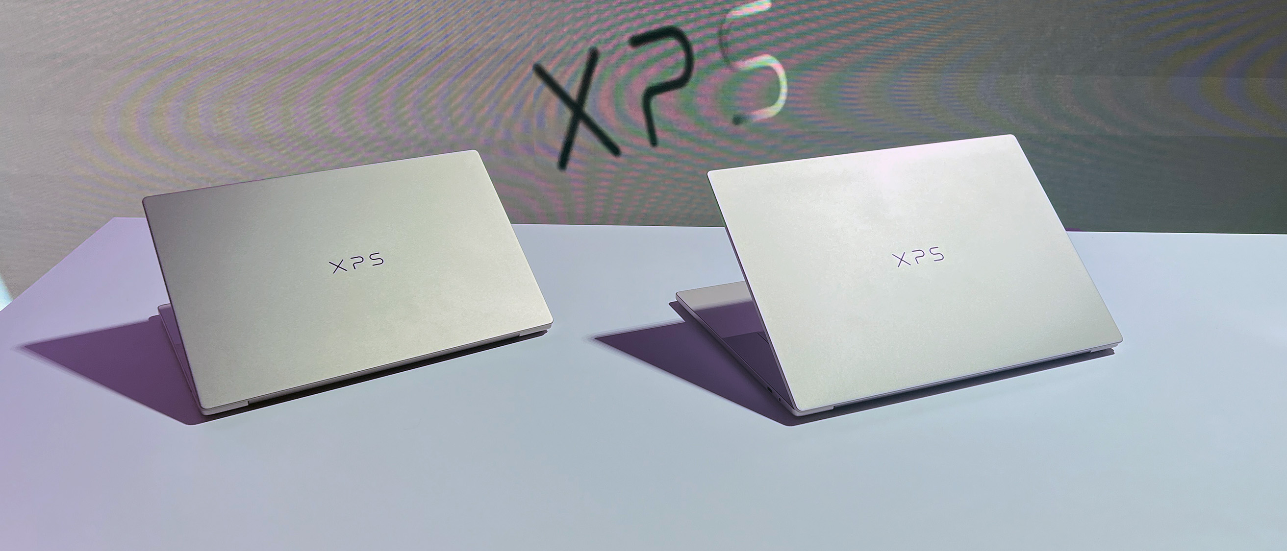 A Dell XPS 14 and Dell XPS 16 sitting on display