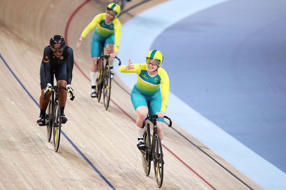 Stephanie Morton doing a celebratory victory lap after her Keirin win