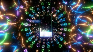 Tetris Effect-gameplay, der viser neonfarver, der flyver rundt om et tetrisbrætTetris Effect-gameplay, der viser neonfarver, som flyver rundt om et tetrisbræt