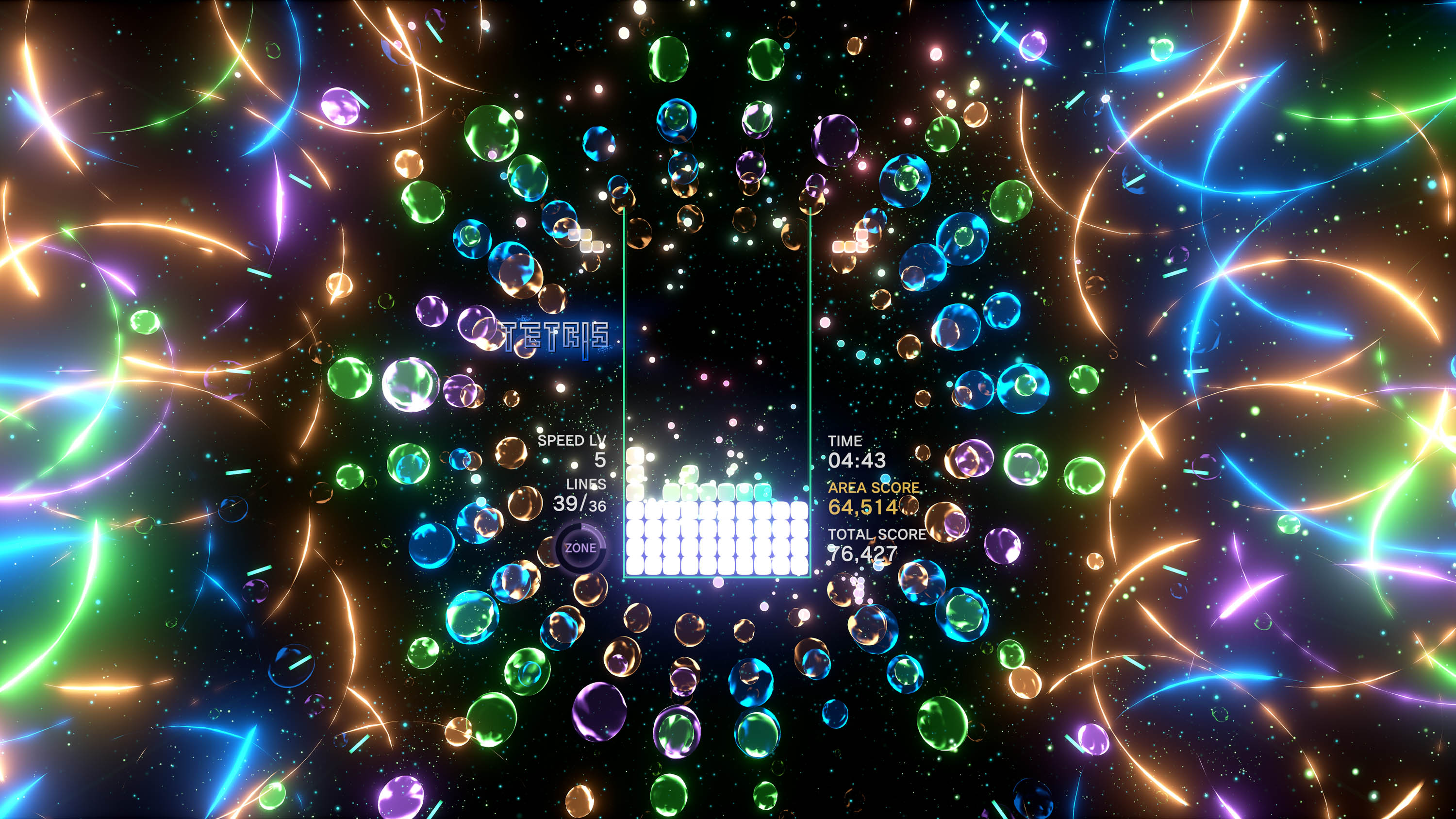 Tetris Effect gameplay showing neon-co,ors flying around a tetris board