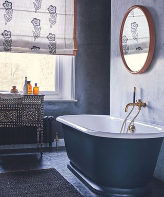 Black bathroom with freestanding bath tub