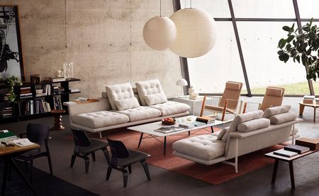 White sofas & chairs on large rug in living space