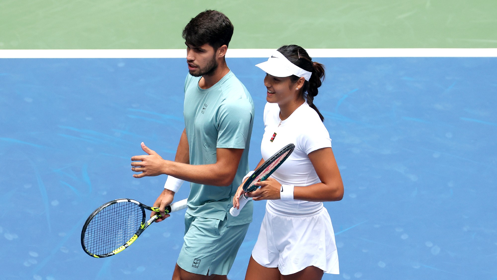 Carlos Alcaraz and Emma Raducanu during their mixed doubles match against Jack Draper and Jessica Pegula at the US Open