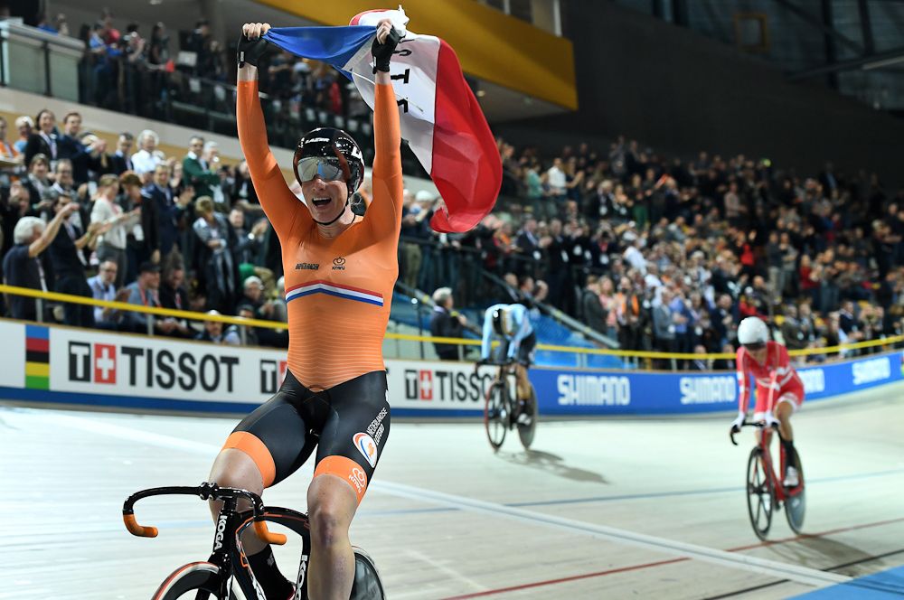 Netherland's Kirsten Wild celebrates after her victory in the women's scratch race at The UCI World Cycling Championships in Apeldoorn