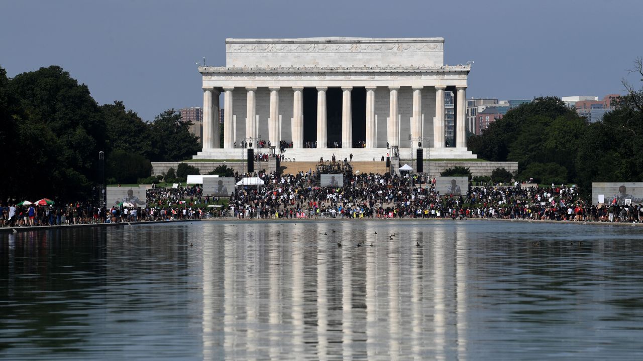 demonstrators walk to the lincoln memorial for the commitment march get your knee off our necks protest against racism and police brutality, on august 28, 2020, in washington dc anti racism protesters marched on the streets of the us capital on friday, after a white officers shooting of african american jacob blake the protester also marked the 57th anniversary of civil rights leader martin luther kings historic i have a dream speech delivered at the lincoln memorial photo by eric baradat afp photo by eric baradatafp via getty images