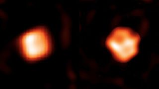 two orange and white balls of gas in space