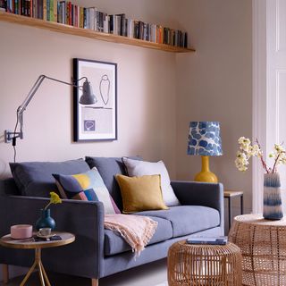 living room with open book storage and cushion