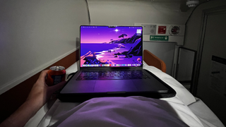 In bed, with a MacBook Pro, on the Caledonian Sleeper train