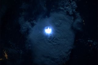 Astronaut on ISS Captures Lightning Flash Illuminating Clouds