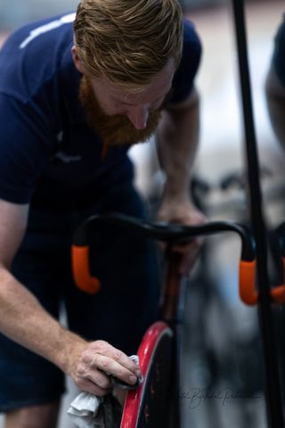 Tim de Boer wipes down a red Dugast tyre