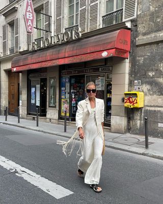 @annaaborisovna wearing a Zara linen dress and fringe blazer