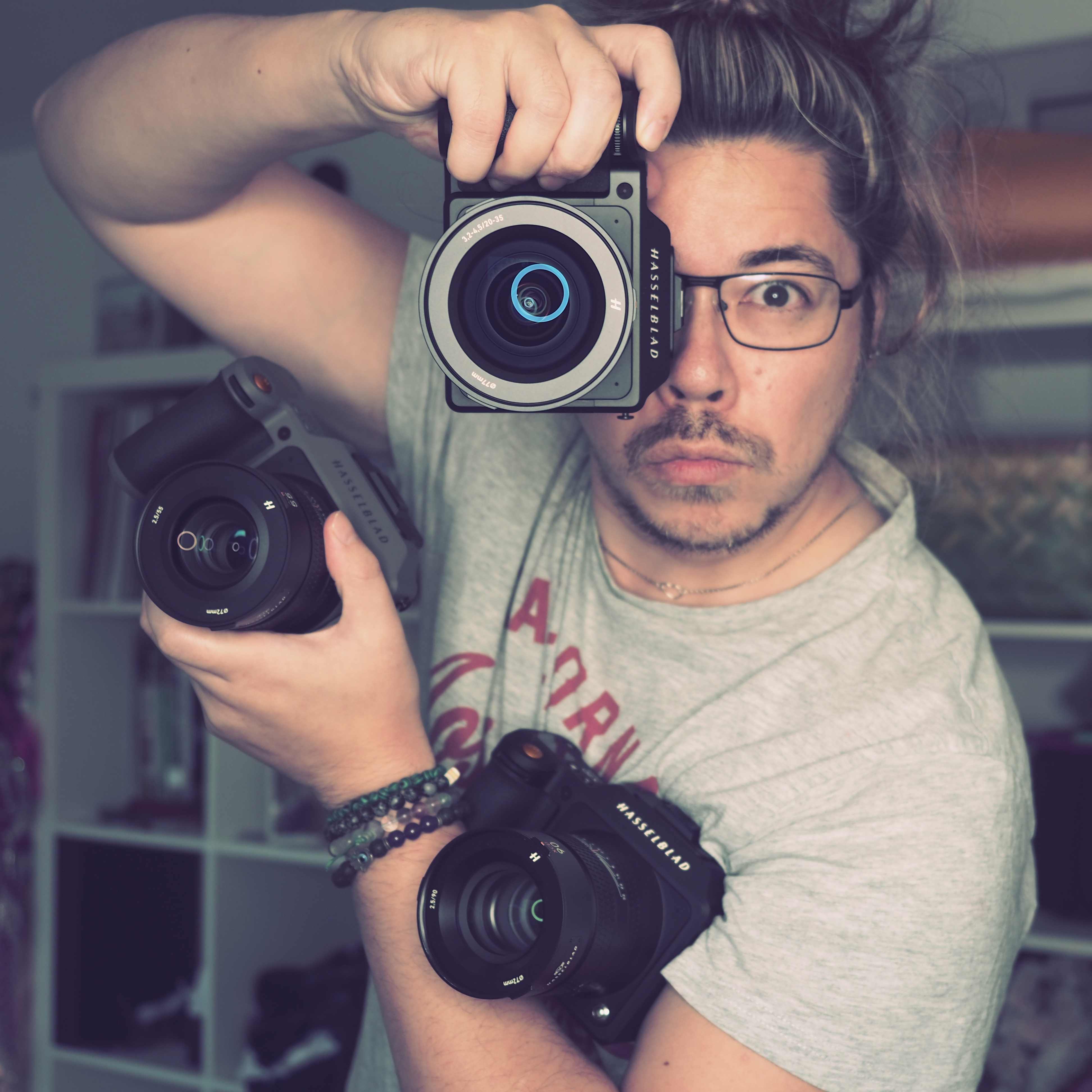 James Artaius clutching a trio of Hasselblad X System cameras
