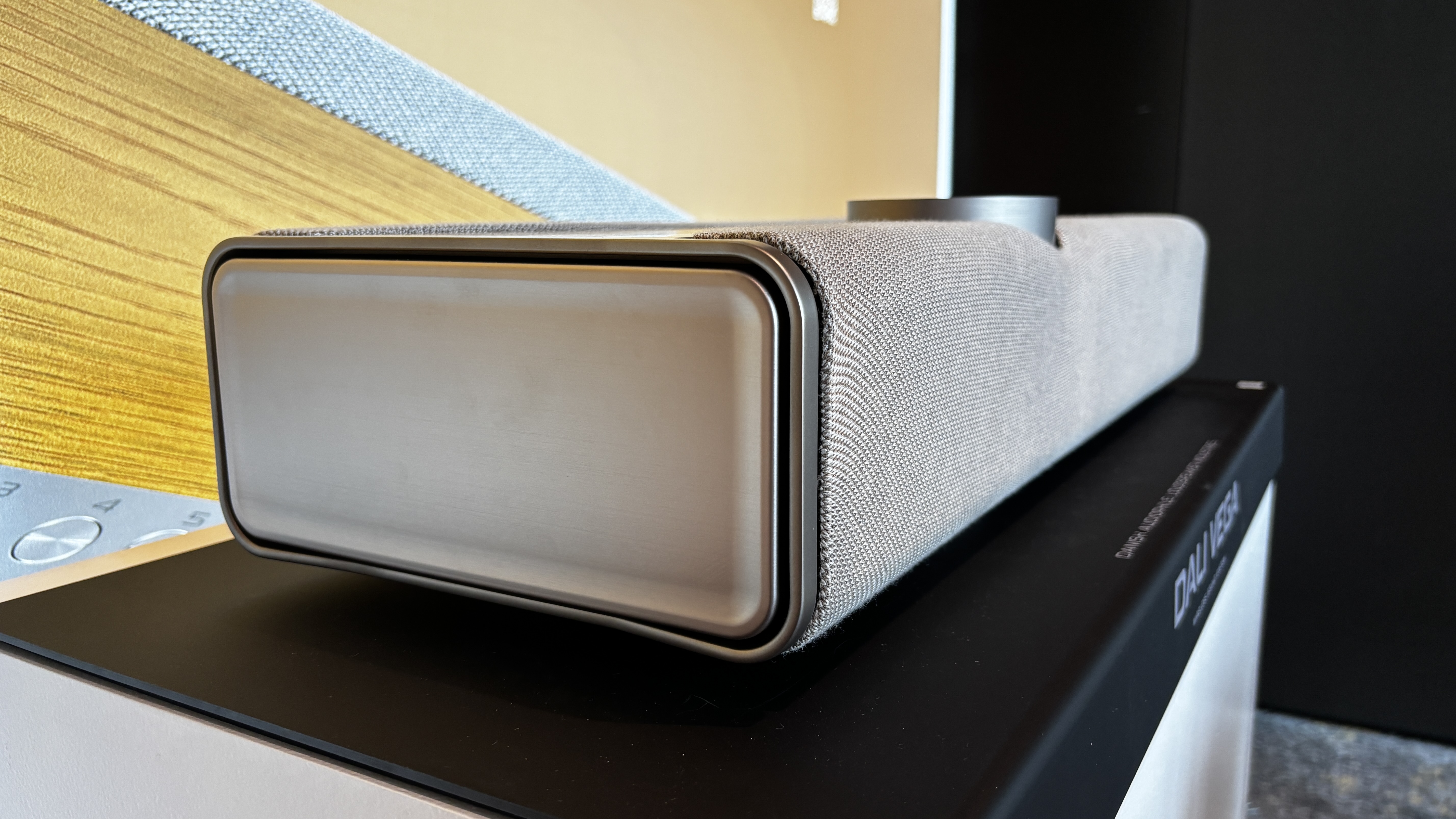 A passive bass radiator at one end of the Dali Vega wireless sound system