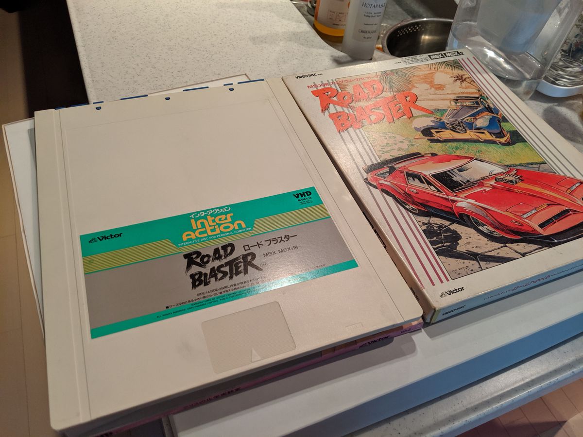 The tabs at the top will slide off, when entered into a player, so the vinyl disc inside can slip out.