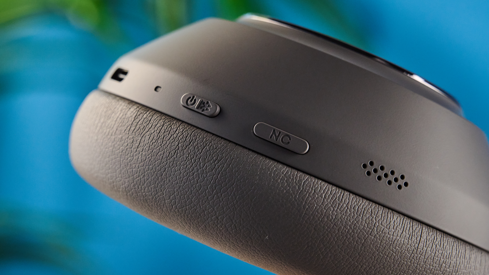 the anker soundcore space 2 pro headphones in mauve gray photographed against a blue tom's guide background