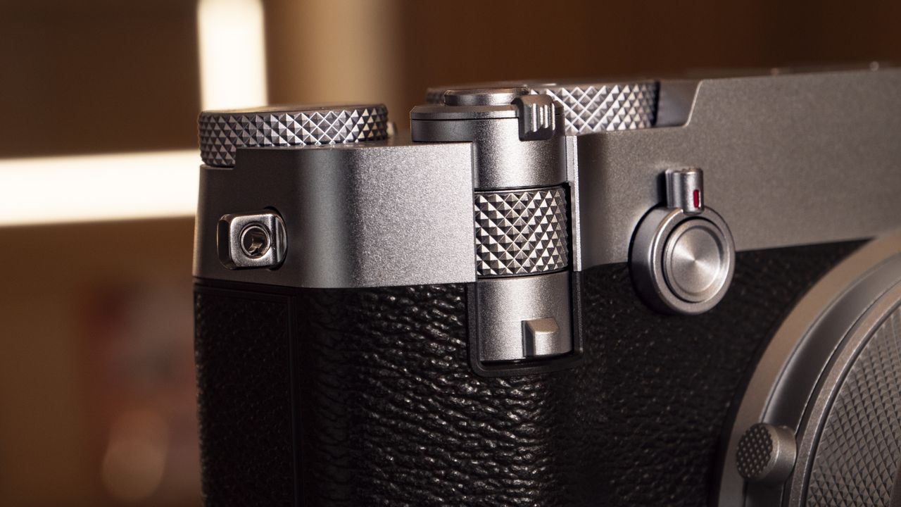 Closeup of the Fujifilm GFX100 RF medium-format compact camera's command dials