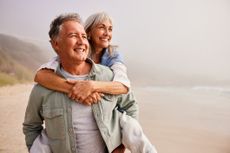 Happy older couple on the beach 