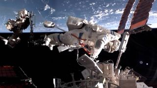 A Shenzhou 20 astronaut performs a spacewalk outside China's Tiangong space station on Aug. 15, 2025.