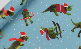 Skiing dinosaurs Christmas wrapping paper