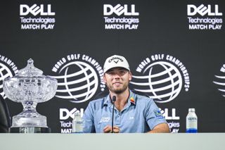 Sam Burns in front of a WGC Match Play banner