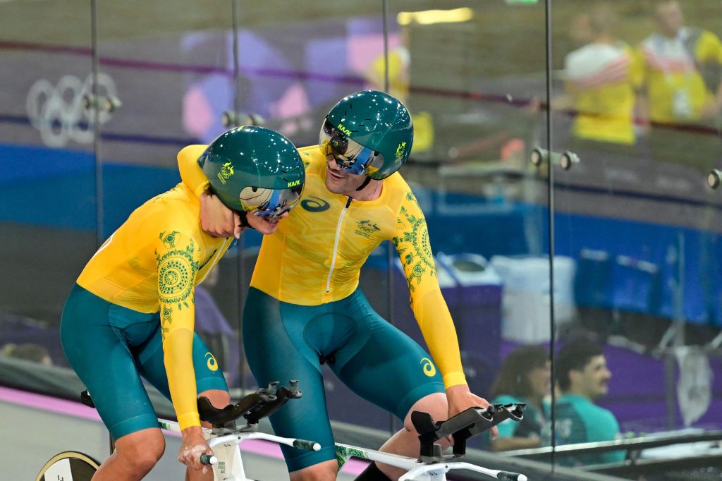 Australia's Conor Leahy and Australia's Kelland O'brien react after a men's track cycling team pursuit first round of the Paris 2024 Olympic Games at the Saint-Quentin-en-Yvelines National Velodrome in Montigny-le-Bretonneux, south-west of Paris, on August 6, 2024. (Photo by John MACDOUGALL / AFP)