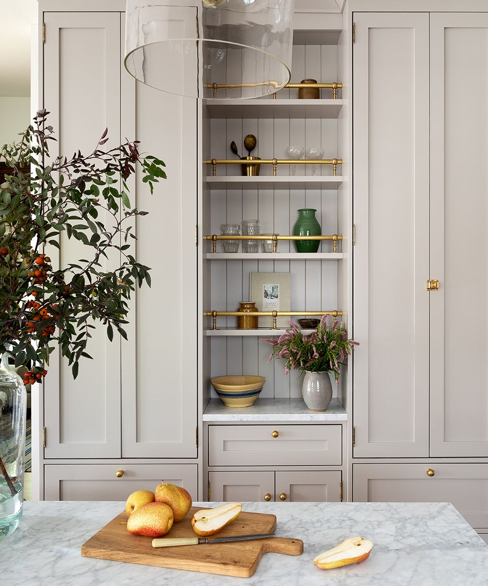 Kitchen cabinets in neutral finish and countertop