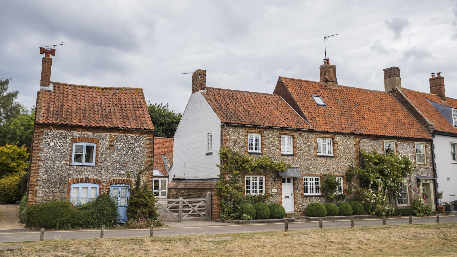 Traditional old cottages line the main road in the pretty Norfolk coastal village of Burnham Market
