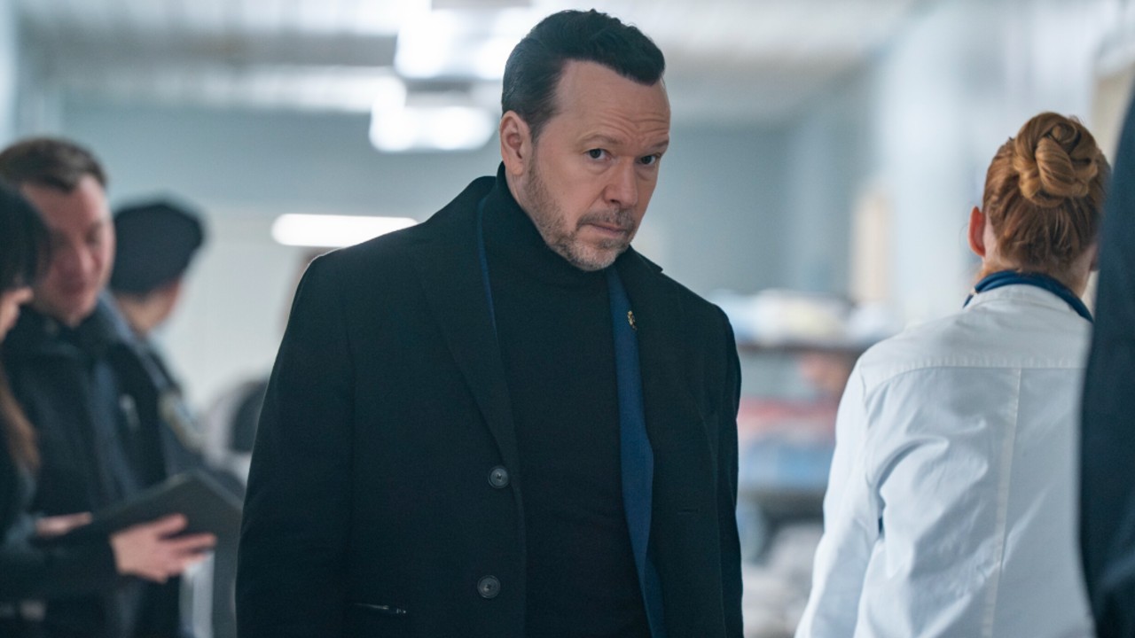 Donnie Wahlberg as Danny walking down a hall in Boston Blue. 