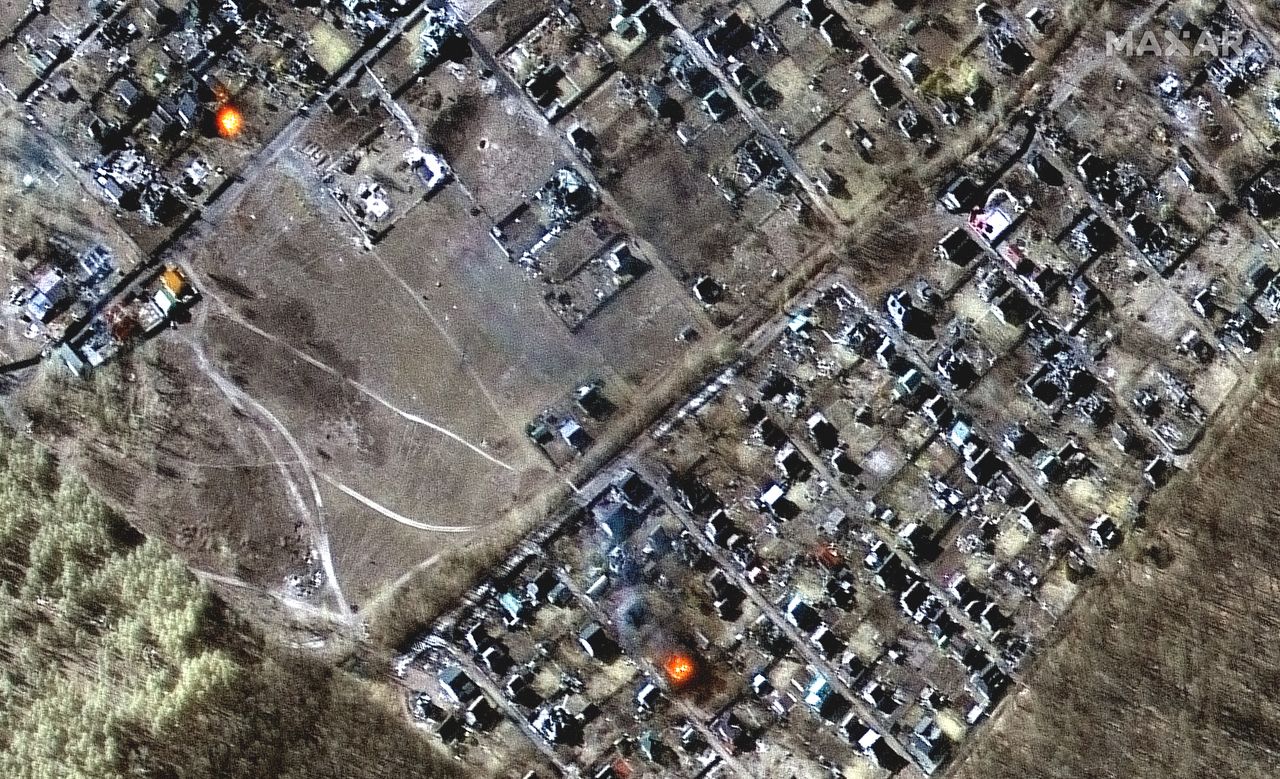 Multispectral and natural color images showing destroyed homes, impact craters and fires in town of Moschun on March 11, 2022 as seen by the WorldView-2 satellite for Maxar Technologies.