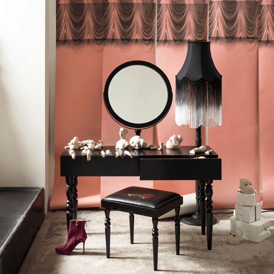 rose pink backdrop and dark black dressing table