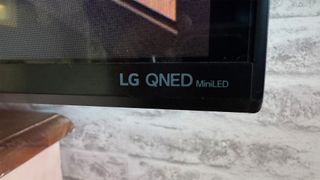 LG QNED91 65-inch LCD TV bottom corner of screen showing logo