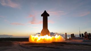 SpaceX's Starship SN24 prototype test-fires two Raptor engines at sunset in Boca Chica, Texas on Aug. 9, 2022.