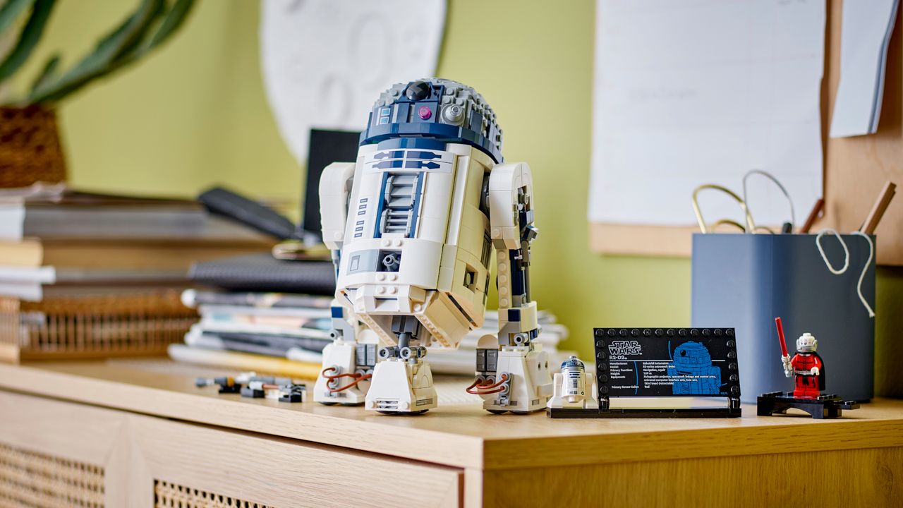Lego R2-D2 on a shelf amongst other household items