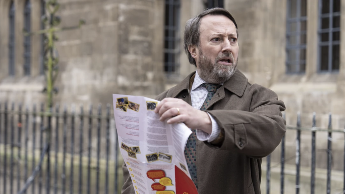 John ‘Ludwig’ Taylor (David Mitchell) struggles with a Cambridge walking tour leaflet in Ludwig