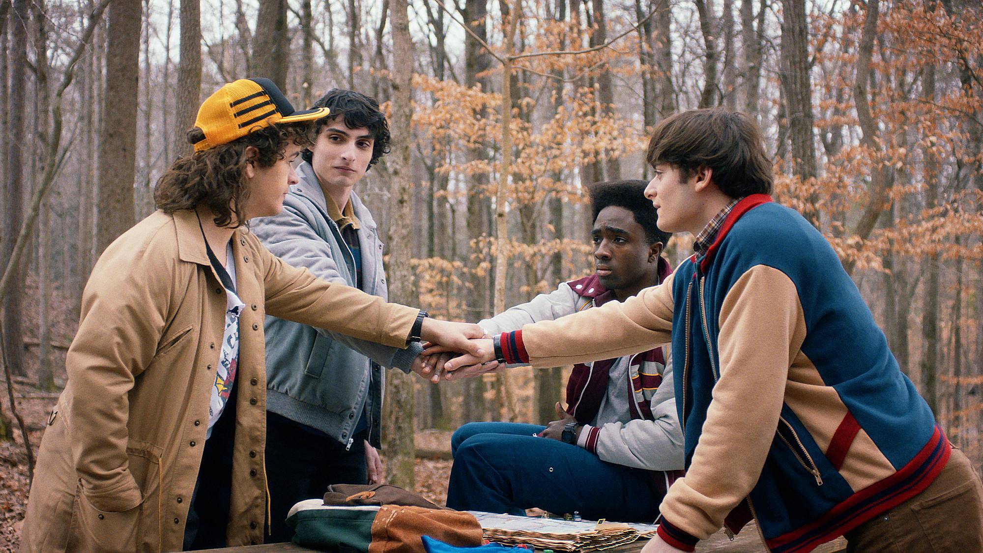 Gaten Matarazzo as Dustin Henderson, Finn Wolfhard as Mike Wheeler, Caleb McLaughlin as Lucas Sinclair, and Noah Schnapp as Will Byers in 