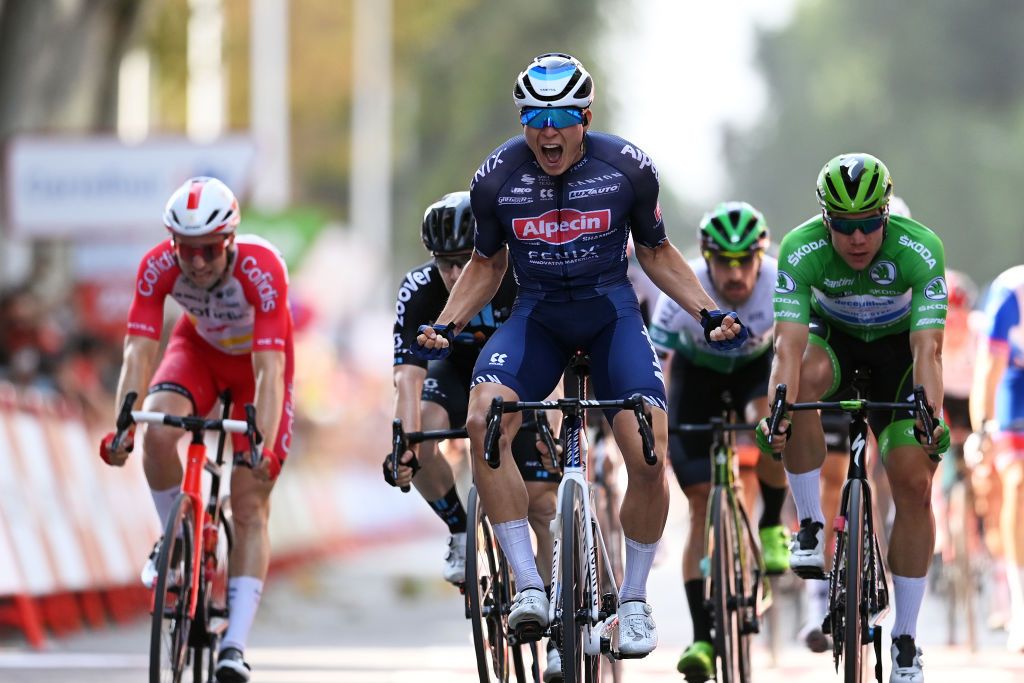 ALBACETE SPAIN AUGUST 18 Jasper Philipsen of Belgium and Team AlpecinFenix celebrates at finish line as stage winner ahead of Fabio Jakobsen of Netherlands and Team Deceuninck QuickStep Green Points Jersey L during the 76th Tour of Spain 2021 Stage 5 a 1844km stage from Tarancn to Albacete lavuelta LaVuelta21 on August 18 2021 in Albacete Spain Photo by Stuart FranklinGetty Images