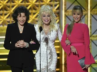 Lily Tomlin (L), Dolly Parton (C) and Jane Fonda speak during the 69th Emmy Awards at the Microsoft Theatre on September 17, 2017 in Los Angeles, California.