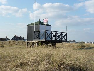 black beach hut