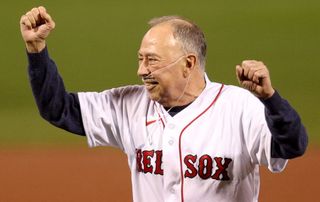 Jerry Remy, Hall of Famer and Boston Red Sox broadcaster, reacts after the ceremonial first pitch during the American League Wild Card game against the New York Yankees at Fenway Park on October 05, 2021 in Boston, Massachusetts.