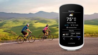 Garmin Edge Explore 2 cycling computer superimposed on a photo of two people cycling in the countryside