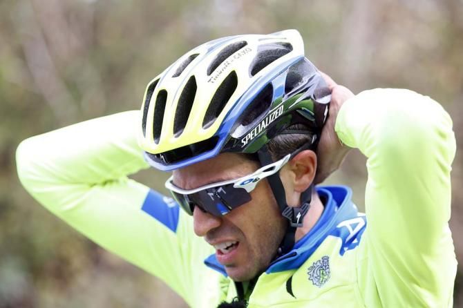 Alberto Contador adjusts his helmet
