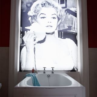bathroom with white sink and photo frame on wall