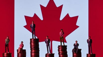 Illustrative photo showing small figures standing on a stack of coins, with the Canadian flag in the background