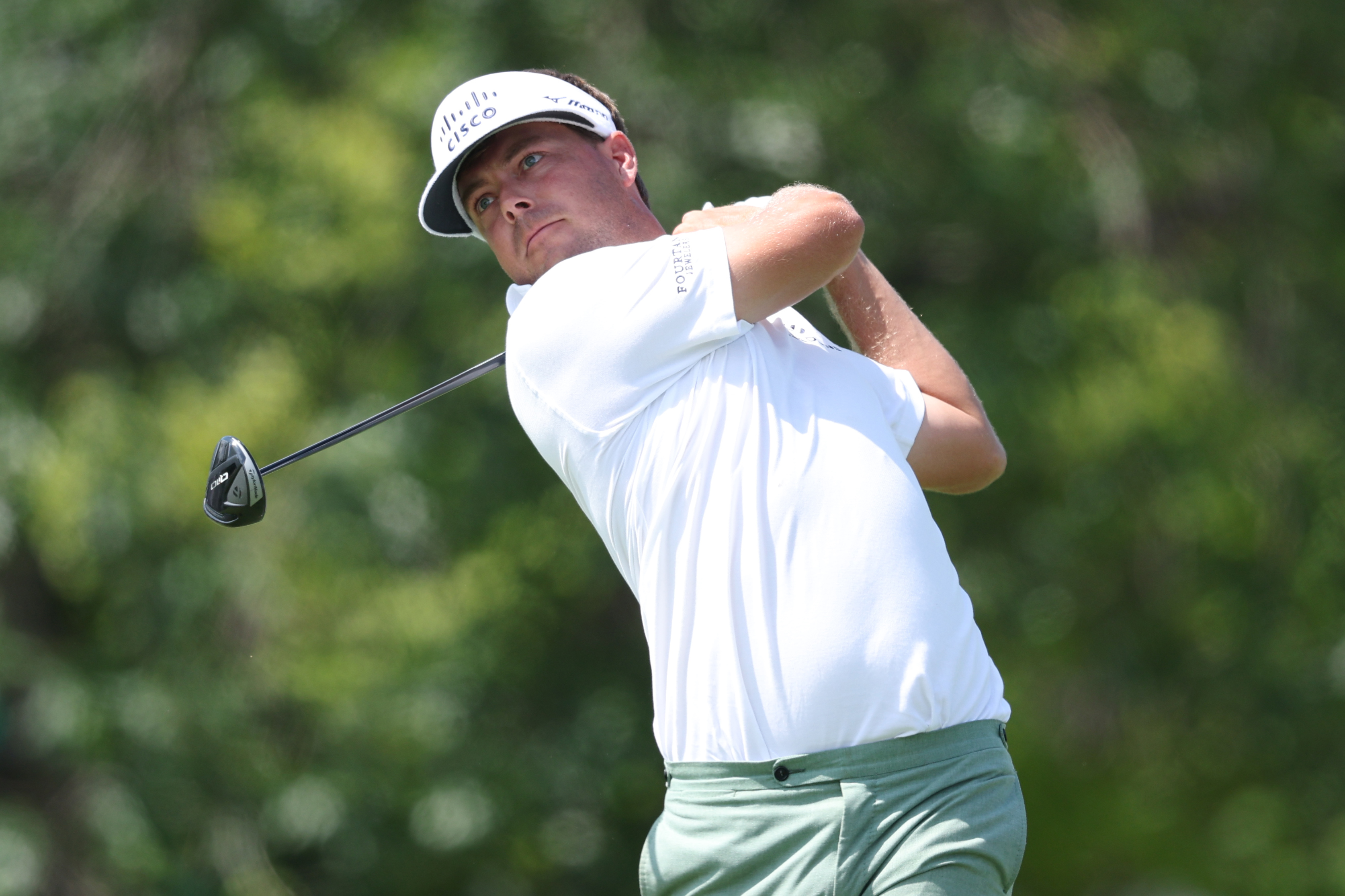 Keith Mitchell hits a fairway wood