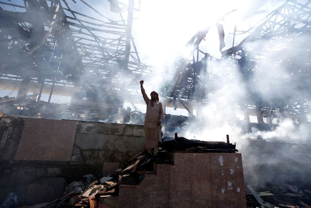 A man in a bombed out house in Sanaa.