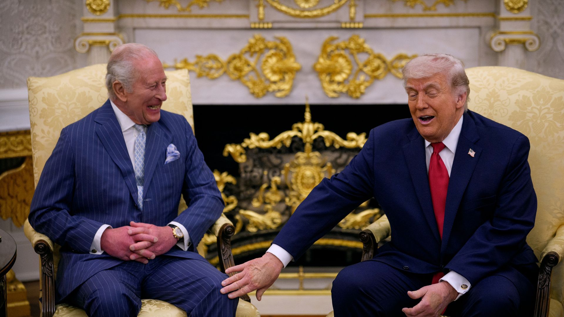 President Donald Trump touches King Charles III during a meeting in the Oval Office of the White House on April 28, 2026