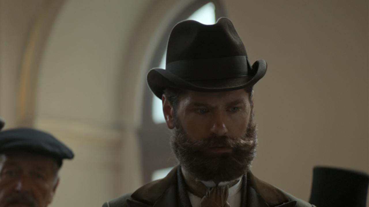 Kyle Soller with a big beard, playing Robert Todd Lincoln in Death by Lightning