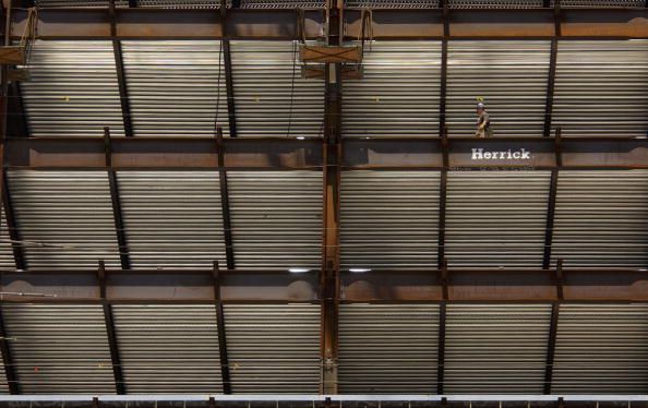 A steelworker walks through a Los Angeles high-rise.