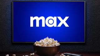 Max logo on TV with popcorn and remote control on table 