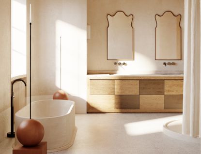 A bathroom made in natural materials with two organic-shaped mirrors adding a touch of elegance